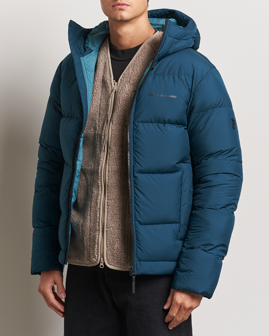 Hombres |  | Peak Performance | Rivel Down Hooded Jacket Ininity Teel